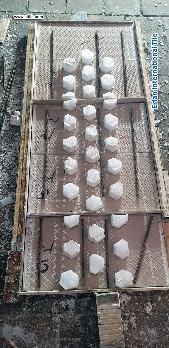 Skilled artisans crafting and installing glazed handmade tiles for a decorative facade, combining heritage techniques with modern precision, www.eitile.com